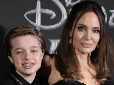 Angelina Jolie sfila con la figlia Shiloh che… ha scelto di essere John