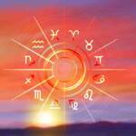 Ruota zodiacale con i dodici segni dell’oroscopo che risplendono alla luce del sole su uno sfondo di cielo dorato al tramonto